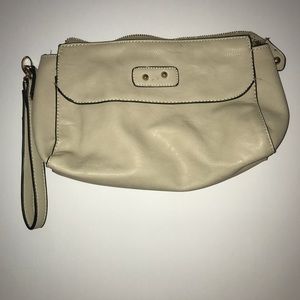 A tan wristlet from a local boutique
